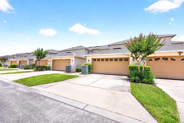 Outside, a rear-entry TWO-CAR GARAGE offers ample parking and storage.