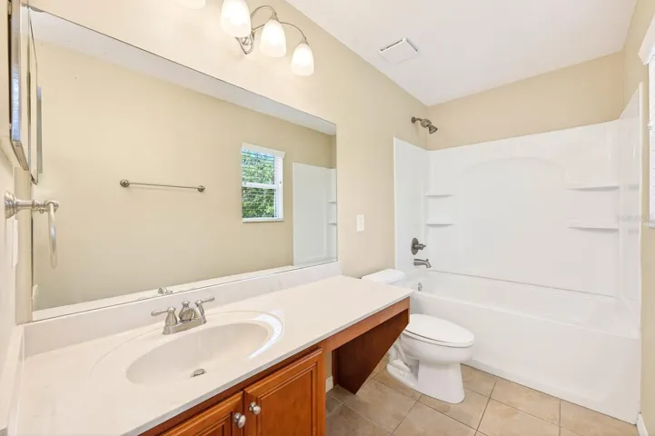 Two additional bedrooms share a SECOND FULL BATHROOM.