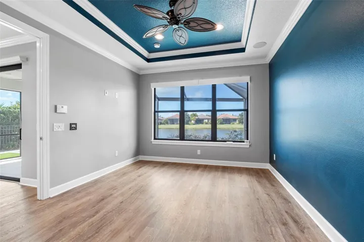 Primary Bedroom with Pool and Lake View