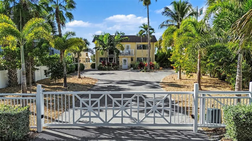 Enter your beachfront property through a custom remote gate, offering further privacy.