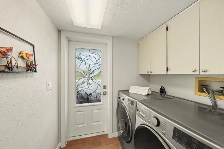 Second level private laundry with access to front balcony