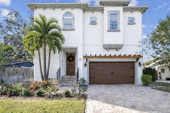 Virtually "staged" front paint, added palm and pergola over garage