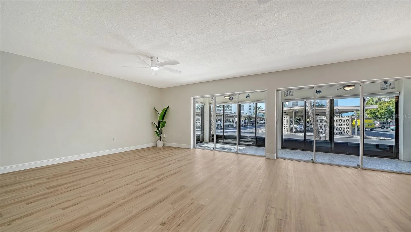 Living Room with 2 sets of sliders leading to the first of two lanais.