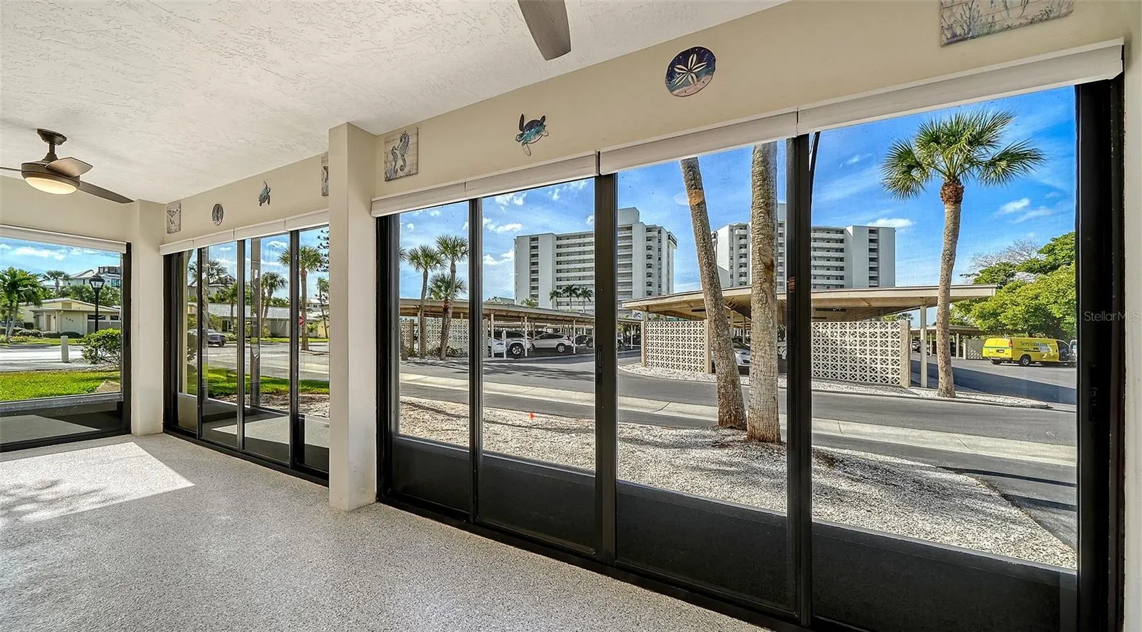Screened and glassed Lanai #1 with epoxy floor and new ceiling fans.