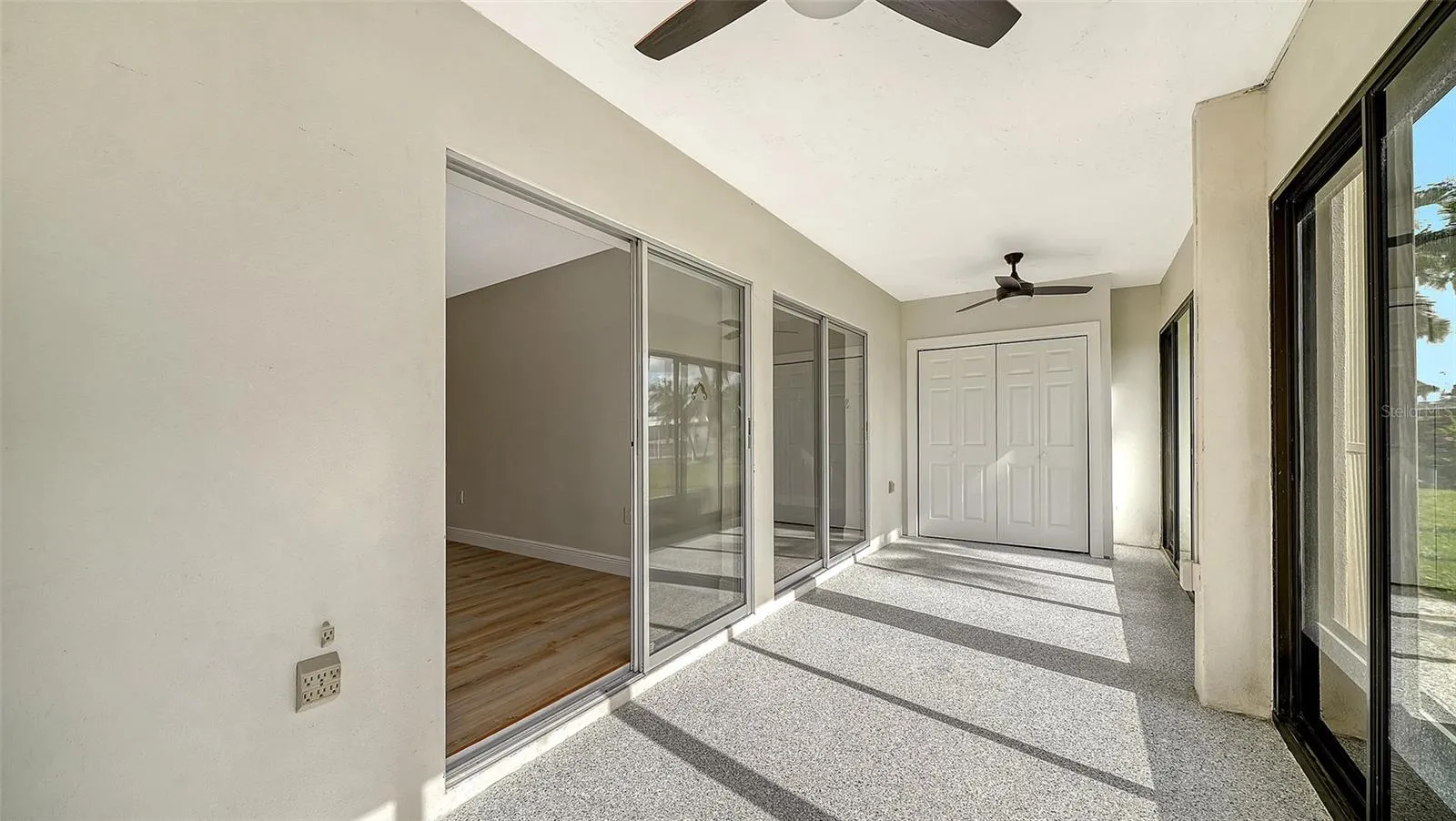 The sliders leading from the Primary Bedroom into the 2nd of two lanais.