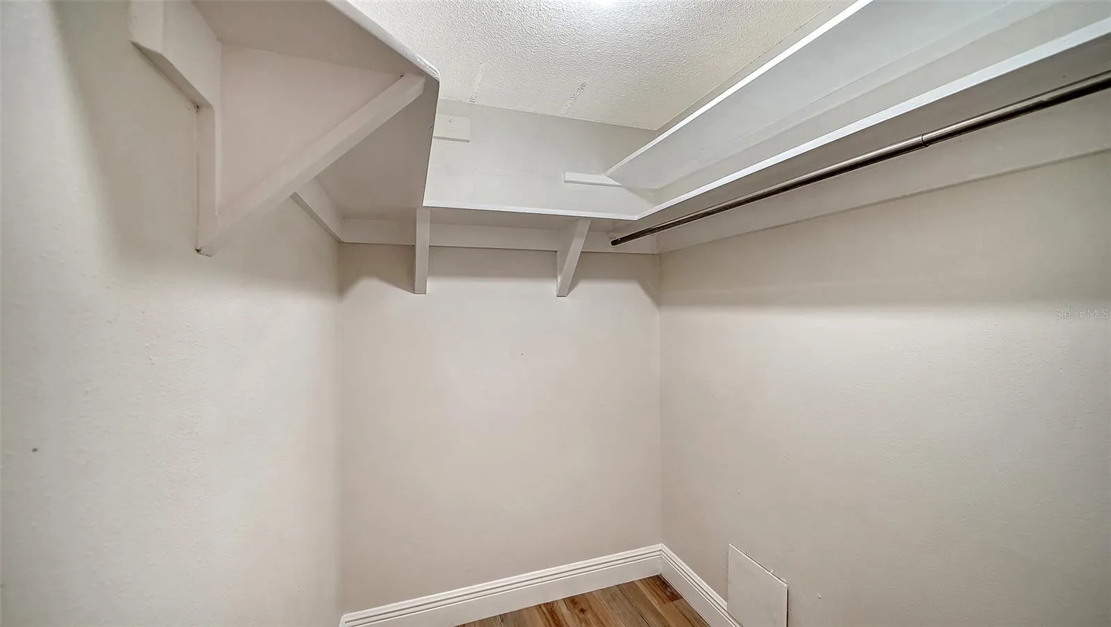 Primary Bedroom walk-in closet.