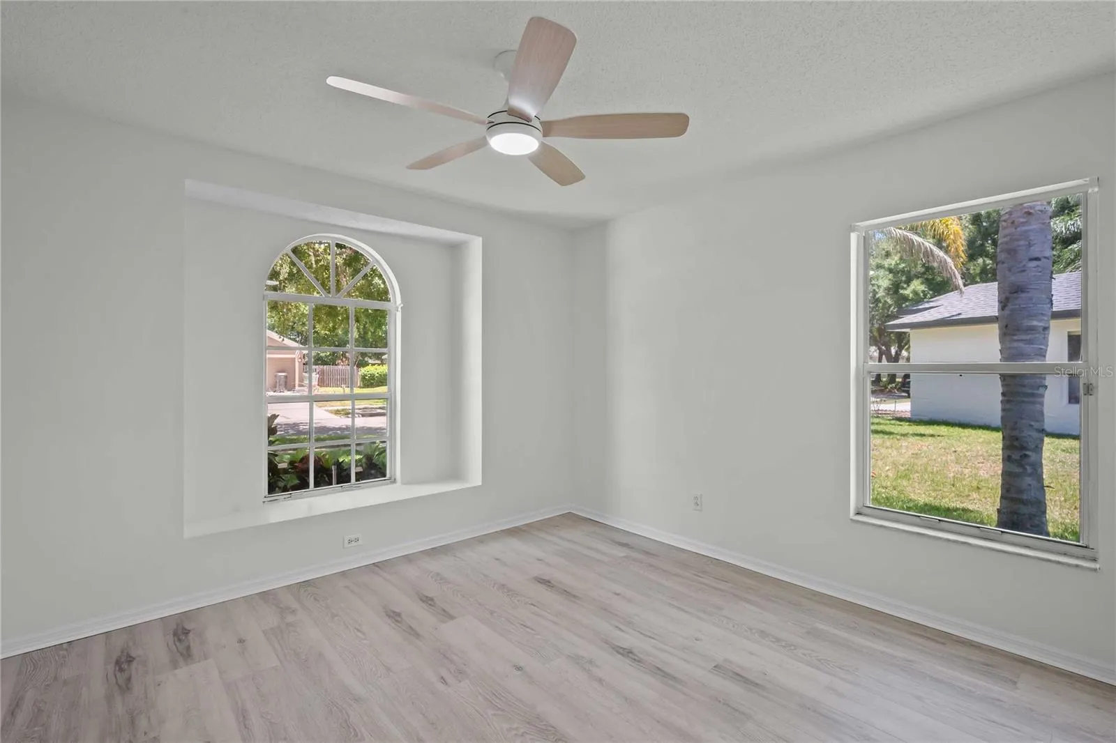 Bedroom #2 - Gorgeous Arched Window to Outside, New Flooring, New Professional Paint, New Ceiling Fan