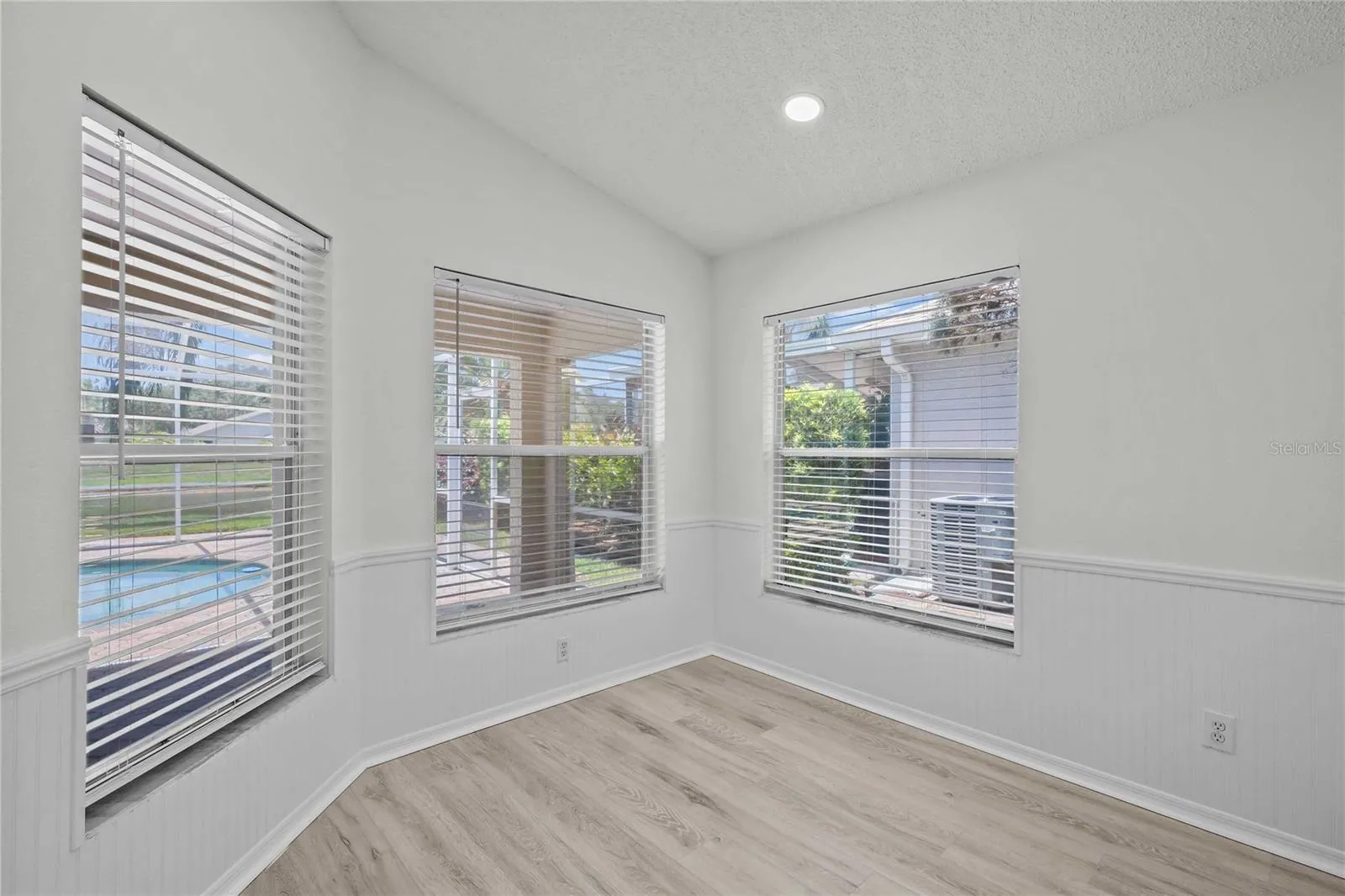 Eat In Kitchen Area - New Flooring, New Professional Paint, Recessed Lighting, Gorgeous windows surround the room with View to Pool and Water