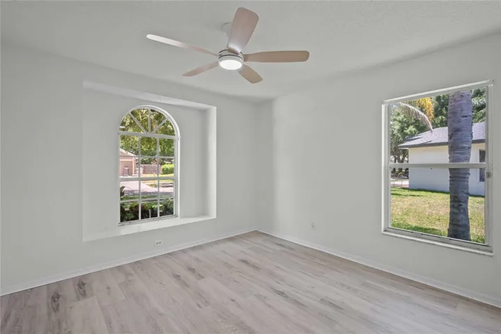 Bedroom #2 - Gorgeous Arched Window to Outside, New Flooring, New Professional Paint, New Ceiling Fan
