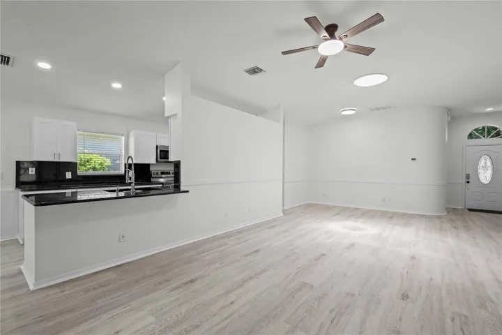 Living Area/Kitchen - New Flooring, Ceiling Fan, Professional Paint