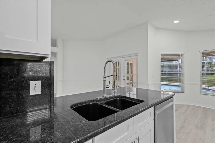 View Kitchen Area. New Kitchen Cabinets, New Flooring, New Recessed Lighting, New Ceiling Fans, and More!