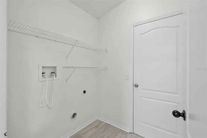 Inside Laundry Room - New Flooring, New Professional Paint, New Recessed Lighting.