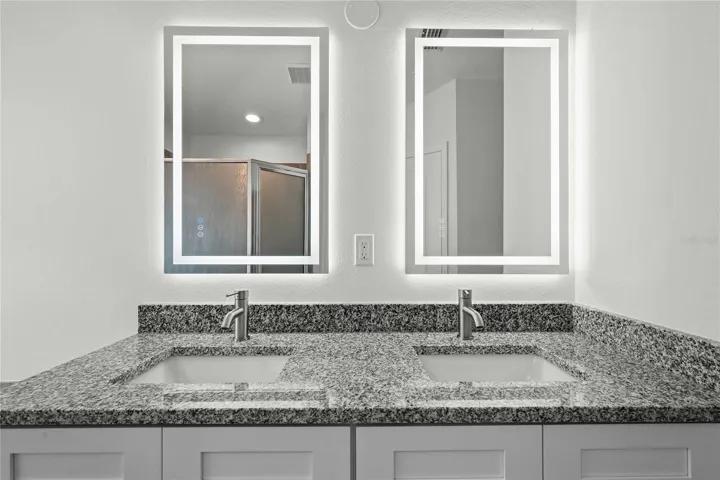 Primary Bathroom - New Dual Vanity & Cabinets, New Mirrors, New Granite Countertops