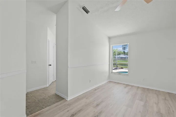 Primary Room - New Flooring, New Professional Paint, New Ceiling Fan