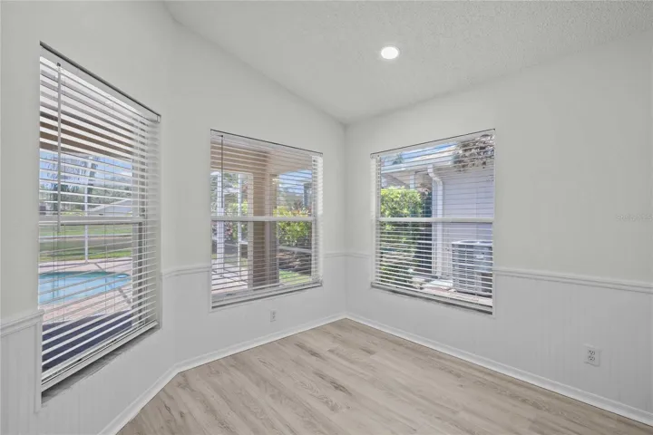 Eat In Kitchen Area - New Flooring, New Professional Paint, Recessed Lighting, Gorgeous windows surround the room with View to Pool and Water