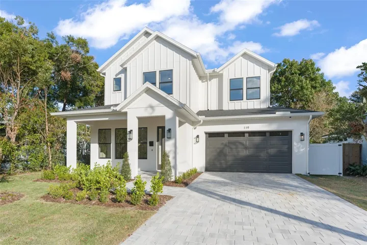 This stunning custom built home as a board and batten exterior; paver driveway, lead walk and front porch; tongue and groove wood ceiling on the front and the rear lanai; gutters and downspouts; irrigation system; on-demand tankless hot water system; epoxy finished garage floor; alone with custom Designer selections throughout.