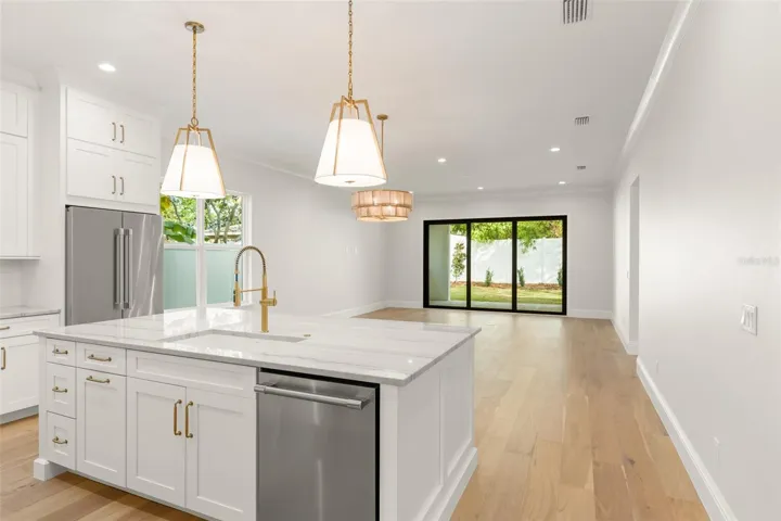 This home offers a great room concept, designed for interaction between spaces, and/or the percent space for entertaining.  One where the kitchen opens to the dining area and then the living room, and then to the large cover lanai.