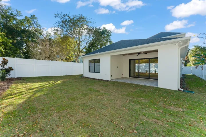 The backyard is fully fenced with a PVC privacy fence.  The home has a gutter and downspouts, and an irrigation system.