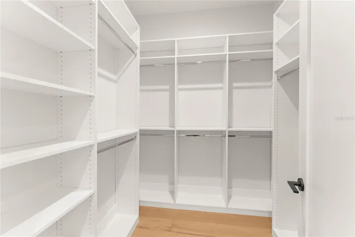 One of the two walk-in closets in the primary bedroom.