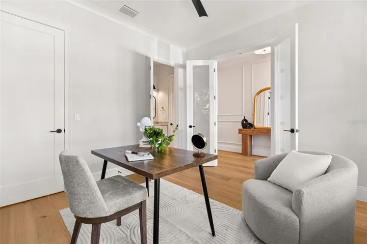 The Study/Bedroom 5 is located off the foyer.  This room offers ample space, a large walk-in closet with custom shelving, as well as a beautifully finished full restroom.