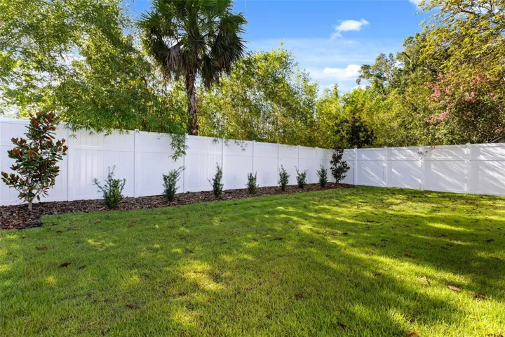 Large, fully fenced rear and side yards, has 6’ to 8’ PVC privacy fencing.