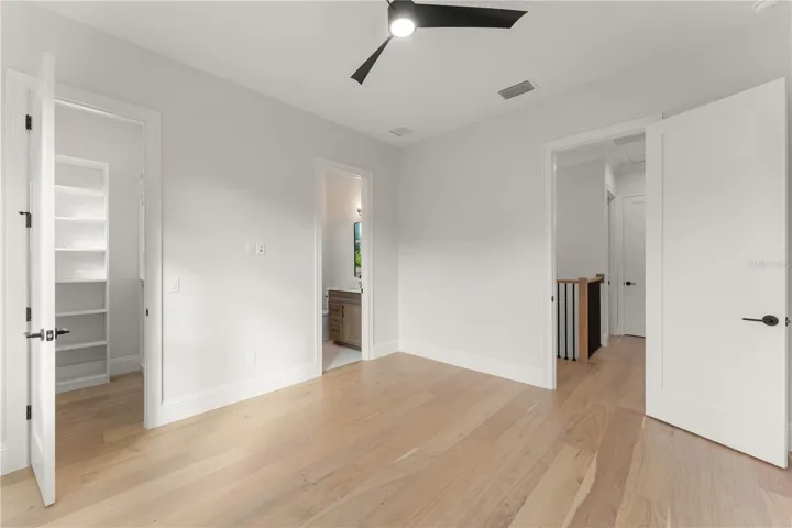 Bedroom 2 has an ensuite bathroom and walking close its with built-in closet shelving.