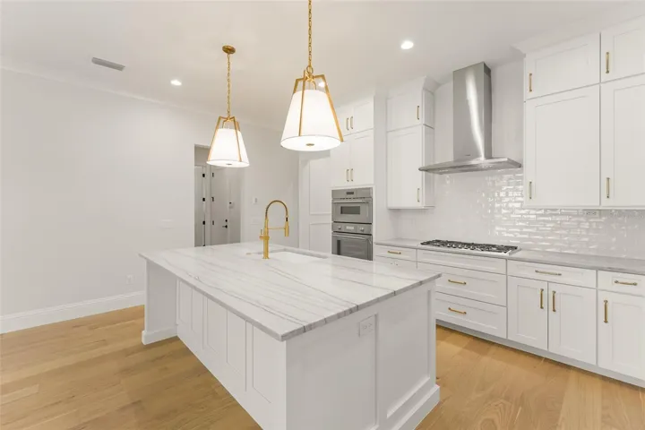 The kitchen island allows for 3 to 4 stools, depending on the size, with storage cabinets on the back side of this island, for items used less frequently.