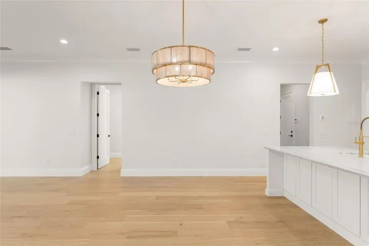 The dining room fixture and island lights bring an added element of beauty to the space.
