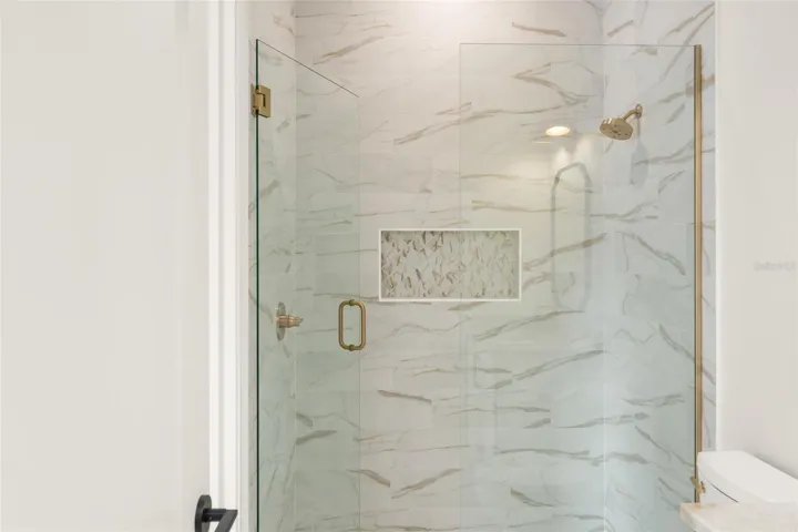 The shower detail in bathroom 4.