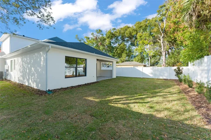 The backyard is fully fenced with a PVC privacy fence.  The home has a gutter and downspouts, and an irrigation system.