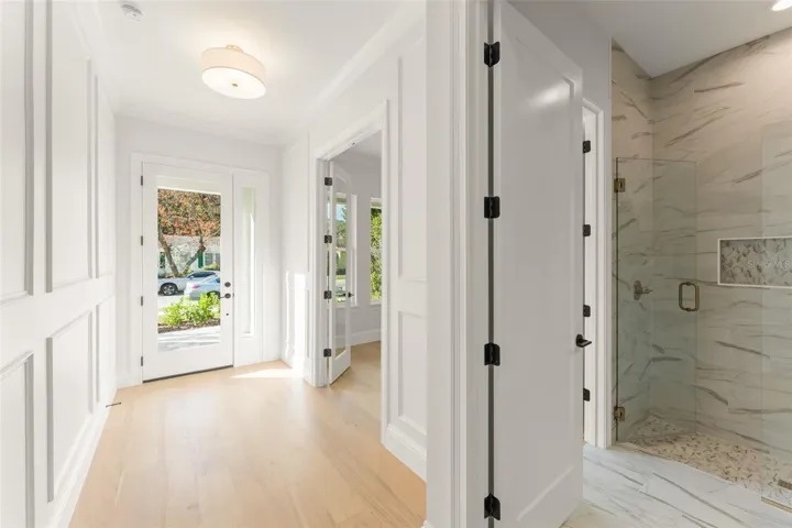 The foyer and entrance hallway is enhanced with trim work, creating a elegant entrance that welcomes all who enter your home.