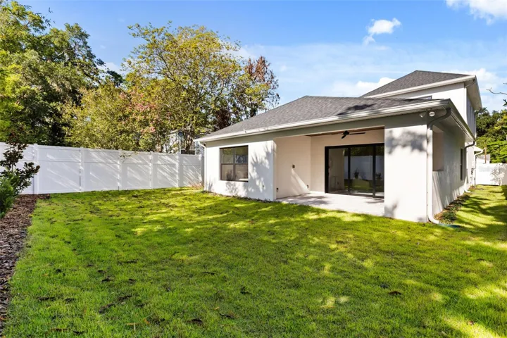 The backyard is fully fenced with a PVC privacy fence.  The home has a gutter and downspouts, and an irrigation system.