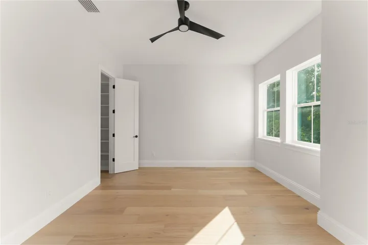 Bedroom 3 has a walk-in closet with built-in closet shelving and access to Bathroom 3.