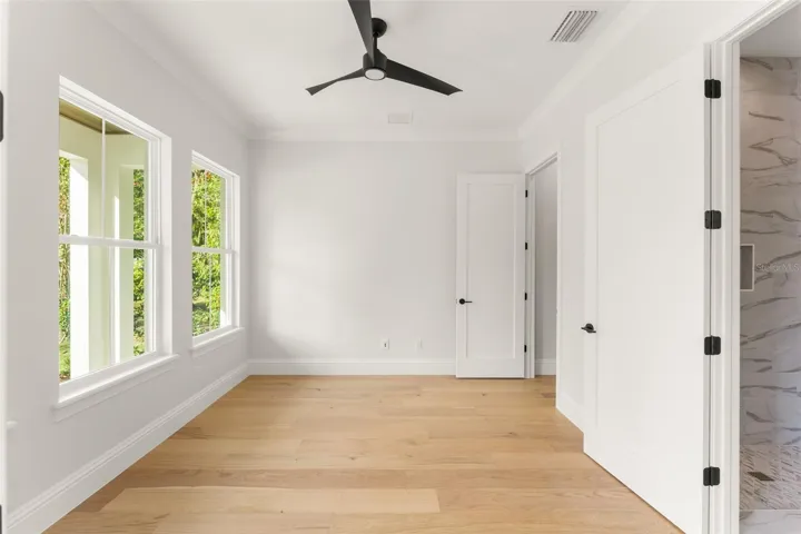 The Study/Bedroom 5 has ample space, a large walk-in closet with custom shelving as well as a beautifully finished full bathroom.