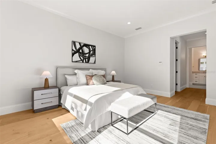 View from the primary bedroom, looking toward the double closets, into the primary bathroom