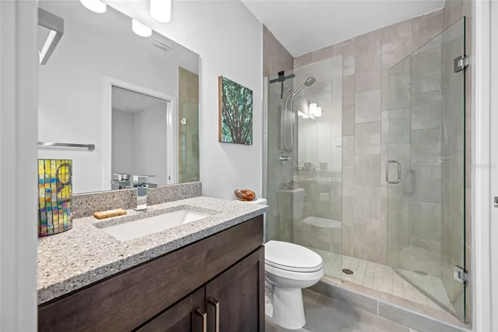 Full bathroom with walk-in shower. First Floor - 3rd Bedroom with en-suite full bathroom & walk-in closet.