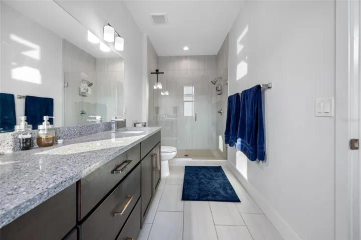 Large primary suite features 10ft ceilings, walk-in closet, ensuite bathroom with dual vanity and walk-in shower. Third Floor