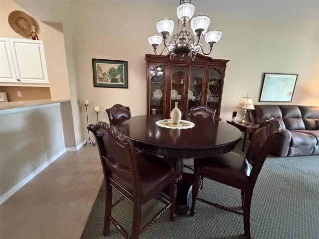 Dining Room w/Breakfast Bar behind table for additional seating