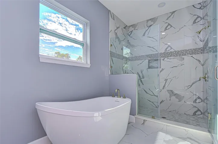 Primary bath w/ similar finishes