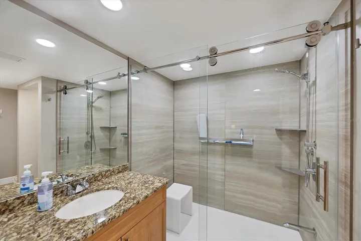 Master Bath has a gorgeous Jacuzzi shower with frameless glass