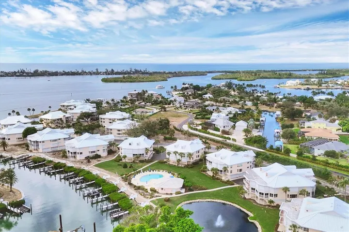 Enjoy views overlooking the lake, marina, pool and extending out to the Intracoastal