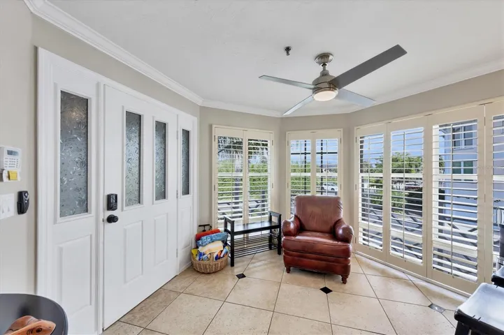 Sunroom is complimented with plantation shutters