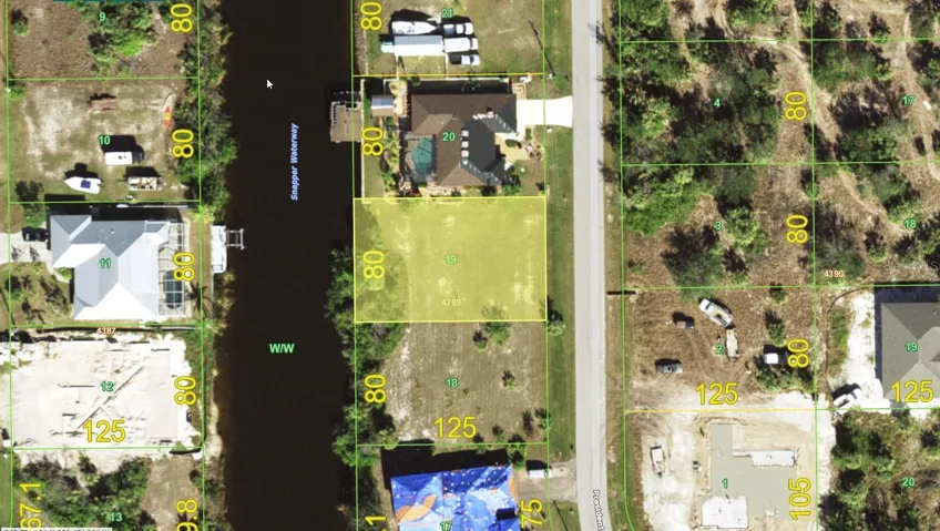 80 feet of Gulf access waterfront, and western 'sunset' rear exposure.