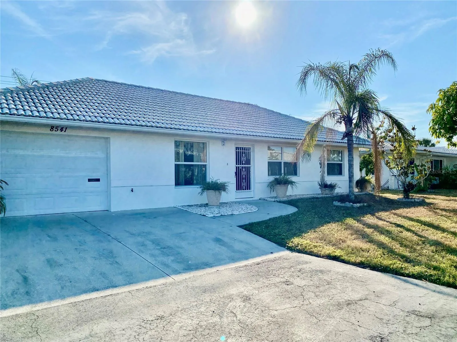 Solid Built Maintenance Free Home with Tile Roof Block Home.   Tropical Landscape