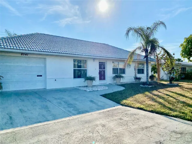 Solid Built Maintenance Free Home with Tile Roof Block Home.   Tropical Landscape