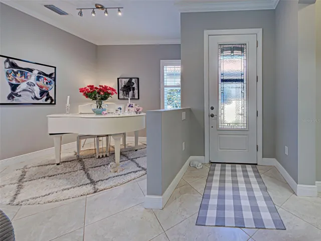 Welcoming Foyer With Leaded Glass Door