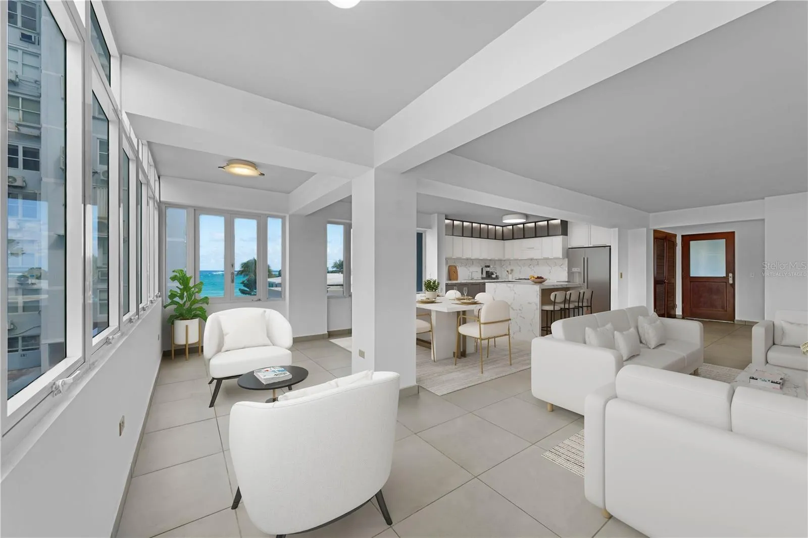 Great Room and Kitchen - This image has been virtually staged and features a conceptual kitchen remodel. The photo does not reflect the current state of the property.