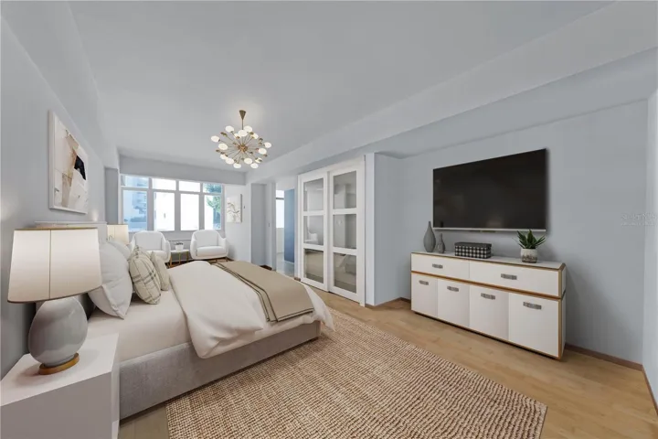 Primary Bedroom - This image has been virtually staged and features a conceptual redesign for the cabinetry. The photo does not reflect the current state of the property.