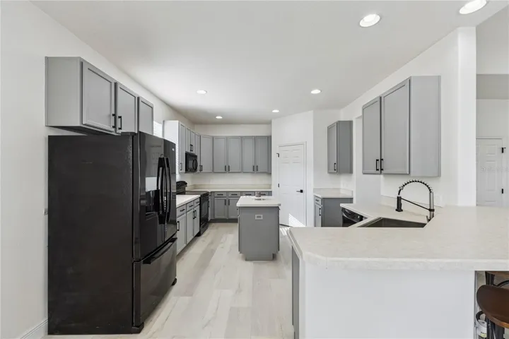 Refreshed Kitchen with Island and Walk-In Pantry