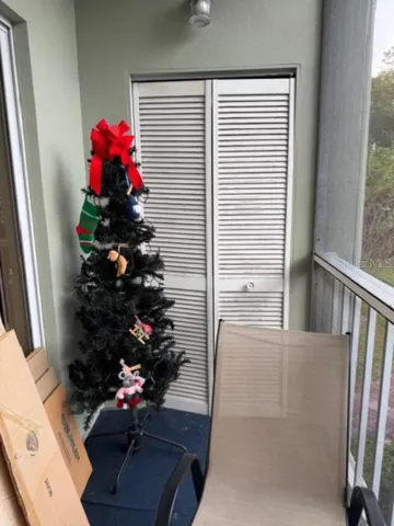 Screened balcony with small storage at end